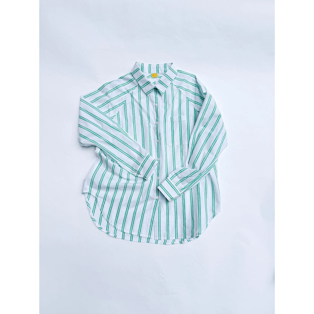 Green and white striped shirt on a light gray background