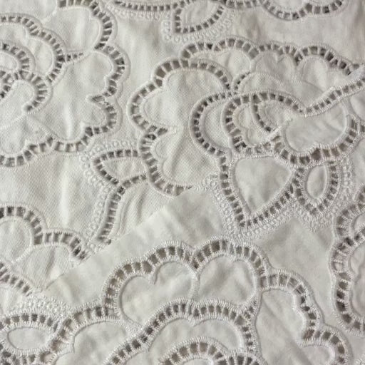 Ivory cut-out floral denim fabric for dressmaking