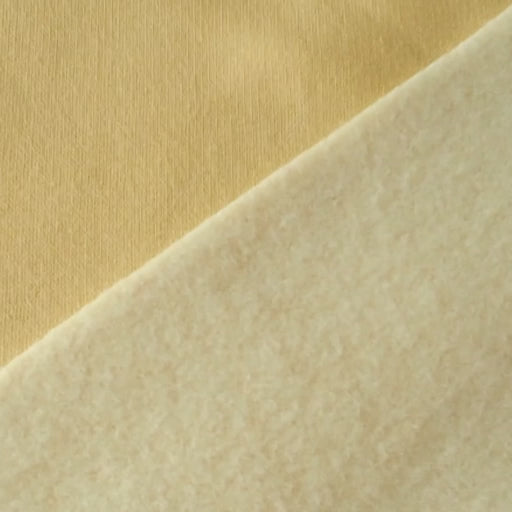 Buttercream yellow fleeceback organic cotton sweatshirting fabric, cosy and stretchy for sweatshirts and joggers.