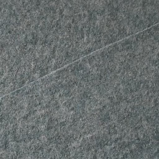 Close up of textured seafoam green boiled wool fabric