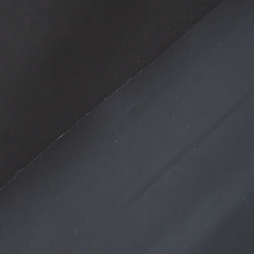 Navy waxed cotton fabric with water-resistant finish for outerwear sewing.