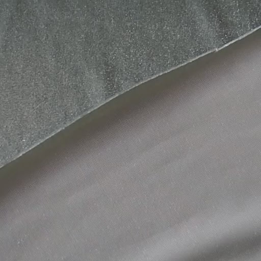 Soft sage green stretch velour fabric with soft sheen for dressmaking.