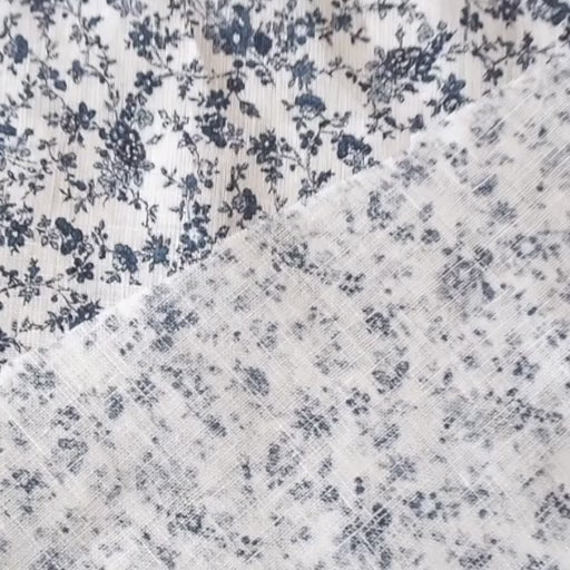 White linen dressmaking fabric with blue floral pattern