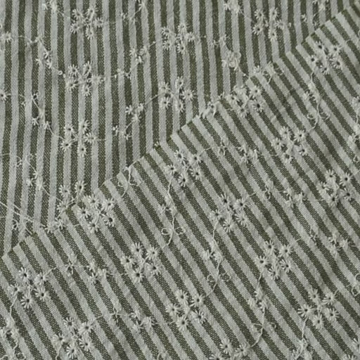 Cotton dressmaking fabric with green and white design and floral embroidery