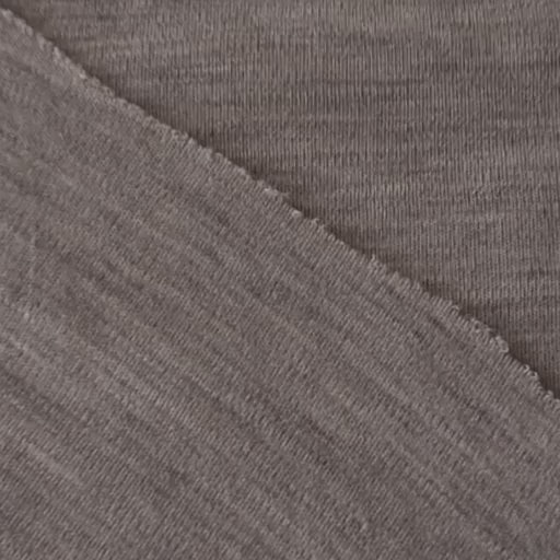 Close-up of beige merino wool jersey fabric with visible texture