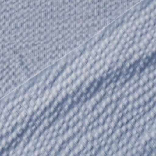 Light blue textured cotton seersucker dressmaking fabric with subtle stripes