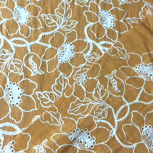 Mustard yellow floral embroidered viscose linen dressmaking fabric