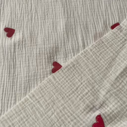 Cream cotton double gauze fabric with embroidered heart pattern for dressmaking