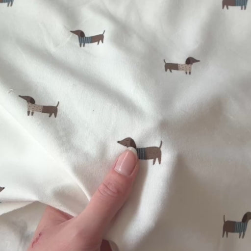 Playful Pups Cotton Jersey Fabric for dressmaking