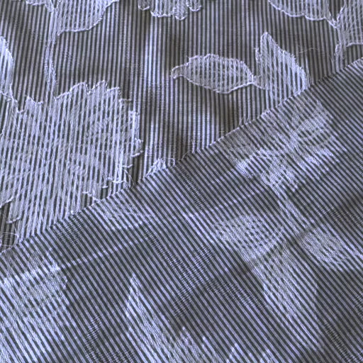 Blue striped jacquard cotton dressmaking fabric with woven floral design