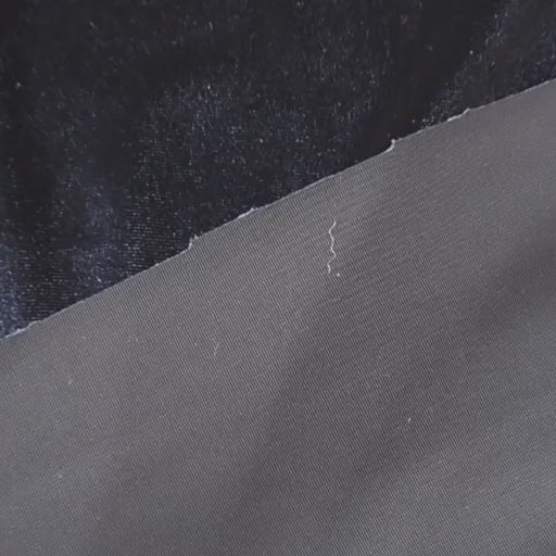 Navy blue stretch velour fabric with soft sheen for dressmaking.