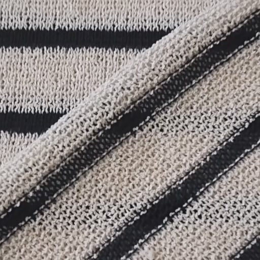 Loose knitted dressmaking fabric with navy and ecru stripes