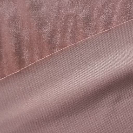 Rose pink stretch velour fabric with soft sheen for dressmaking.