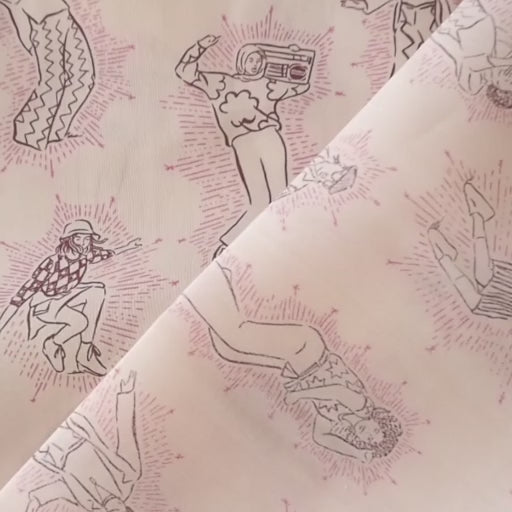 Patterned Liberty fabric with pink line drawings of people on a cream background