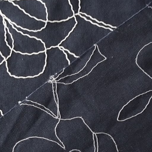 Navy viscose linen dressmaking fabric with embroidered floral pattern