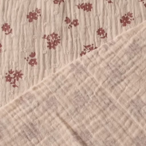 Peach cotton double gauze dressmaking fabric with dobby texture and ditsy terracotta floral pattern