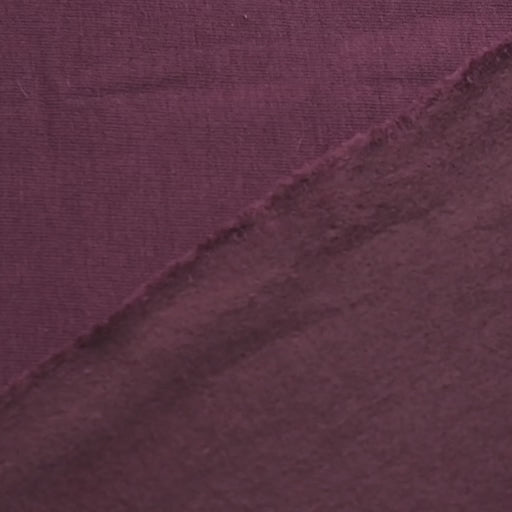 Close up of maroon fleeceback sweatshirt fabric