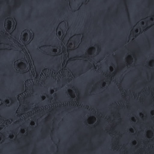 Navy blue embroidered cotton dressmaking fabric with floral pattern