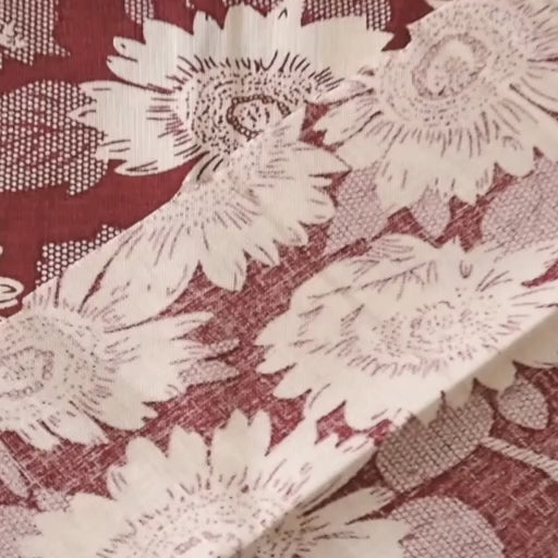 Floral patterned viscose fabric with white flowers on a red background
