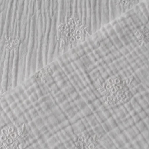 White cotton double gauze embroidered dressmaking fabric with floral embroidered pattern