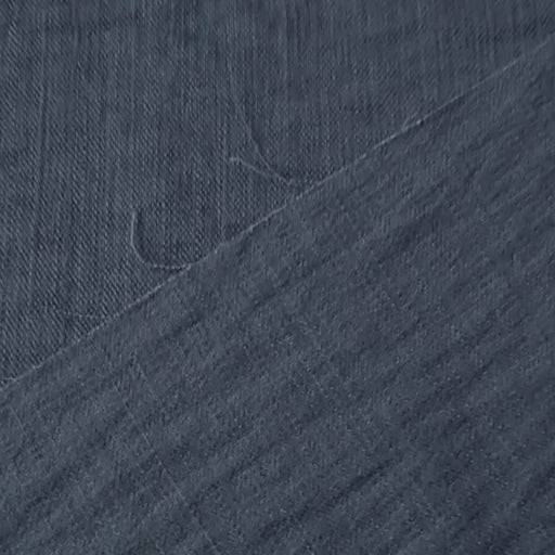 Close-up of navy viscose blend dressmaking fabric with visible texture