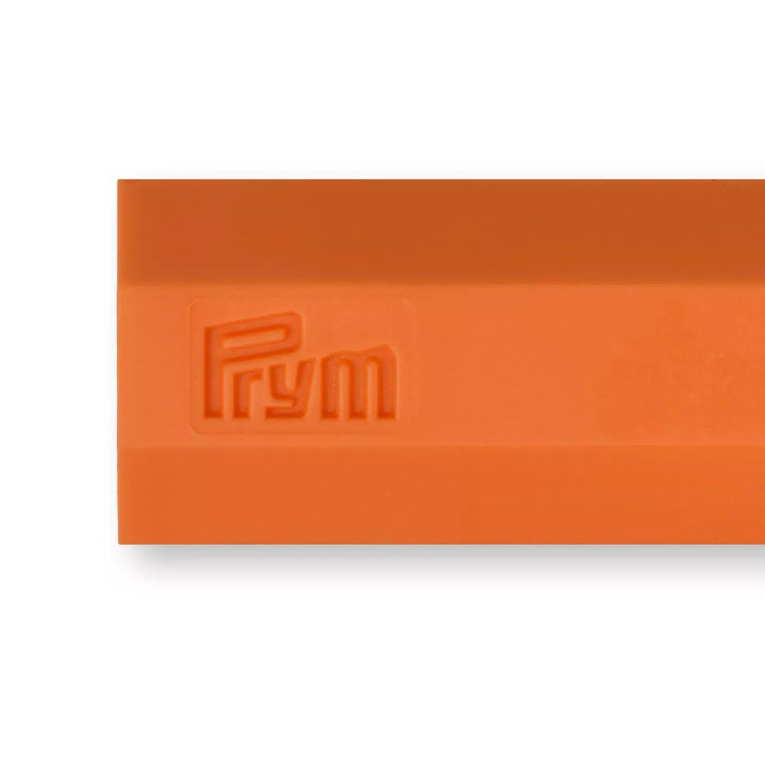 Orange rubber stamp with 'Prym' branding on a white background